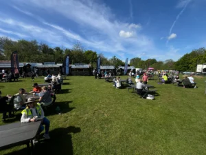 Concession catering with picnic benches on field infron of selection of catering shacks